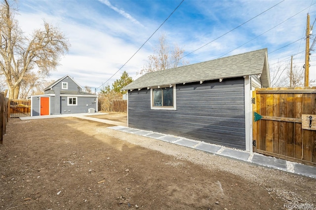 view of side of property featuring an outbuilding