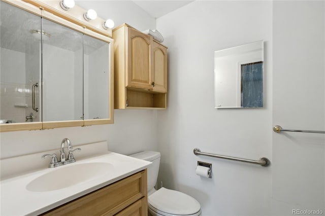 full bath with a shower with door, toilet, and vanity