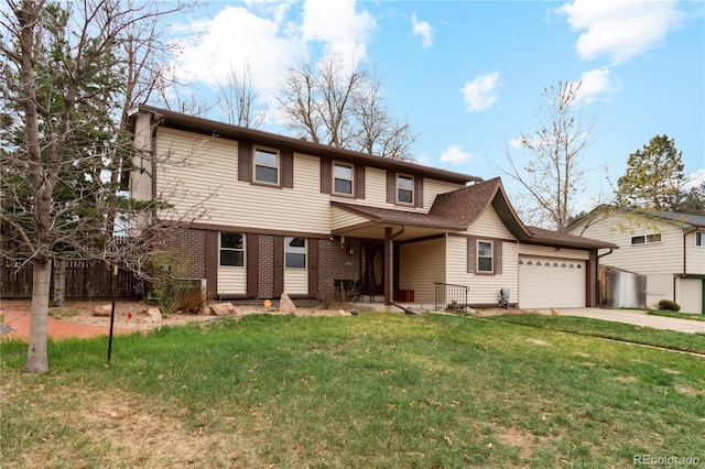 traditional home featuring a garage, driveway, and brick siding
