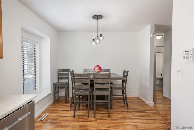 dining room featuring light hardwood / wood-style flooring