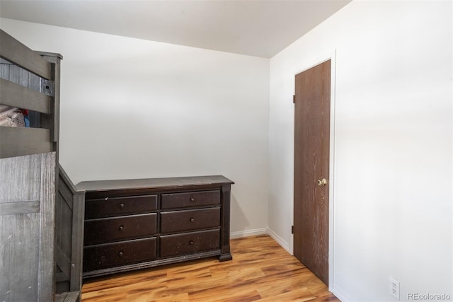 bedroom with light wood-type flooring