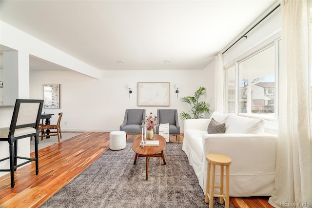 living room featuring wood finished floors and baseboards