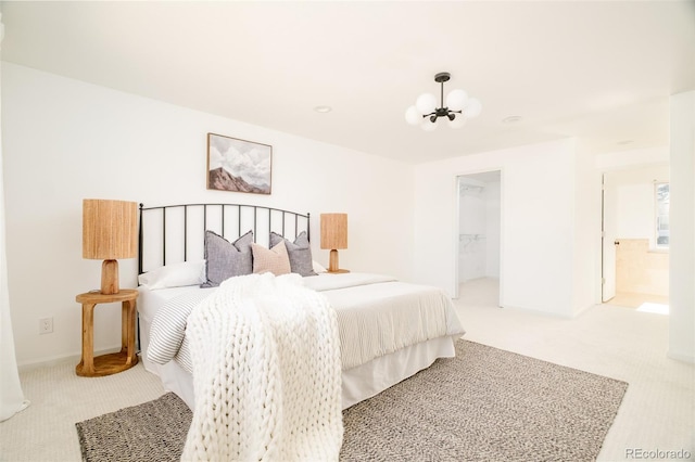 bedroom featuring a chandelier and carpet