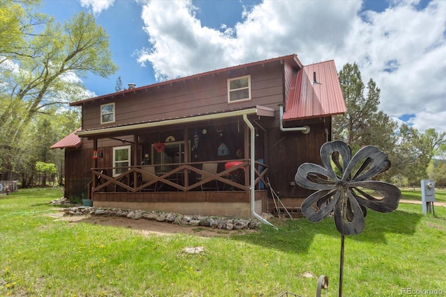1638 County Road 46, Howard, CO 81233 - rear view of house featuring a yard and metal roof