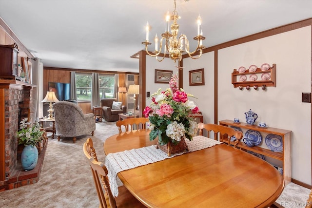 1638 County Road 46, Howard, CO 81233 - dining space featuring light colored carpet, a chandelier, and a fireplace