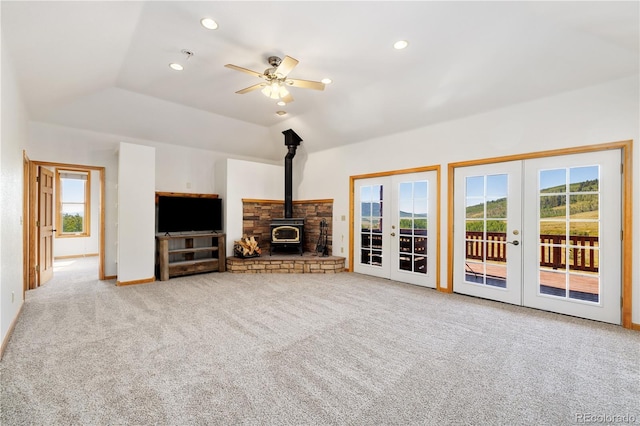 114 Round Hill Rd, Fairplay, CO 80440 - unfurnished living room with french doors, a wood stove, healthy amount of natural light, carpet, and recessed lighting