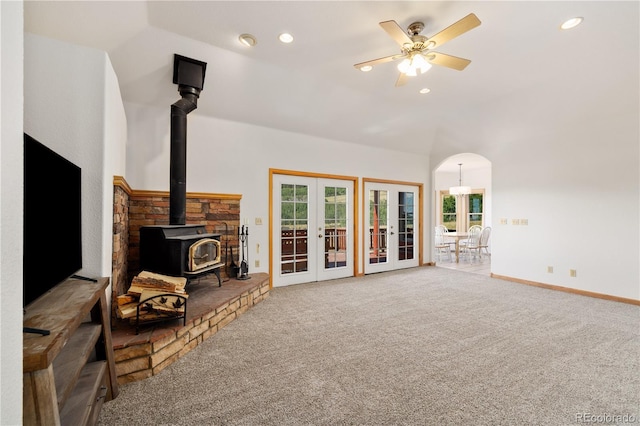 114 Round Hill Rd, Fairplay, CO 80440 - unfurnished living room with a wood stove, french doors, healthy amount of natural light, carpet, and recessed lighting