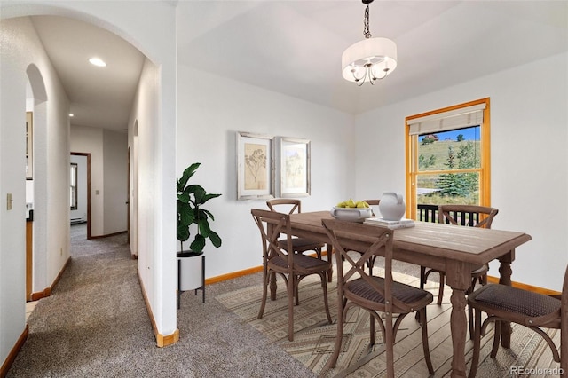 114 Round Hill Rd, Fairplay, CO 80440 - carpeted dining room featuring arched walkways, a chandelier, and recessed lighting