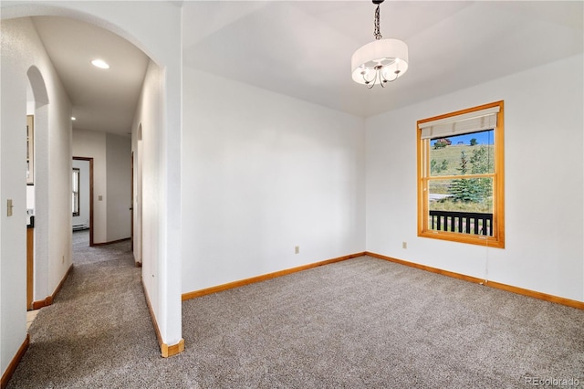114 Round Hill Rd, Fairplay, CO 80440 - carpeted spare room with arched walkways, a chandelier, and recessed lighting