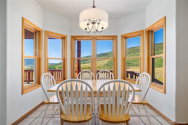 114 Round Hill Rd, Fairplay, CO 80440 - dining room featuring light tile patterned flooring and a chandelier