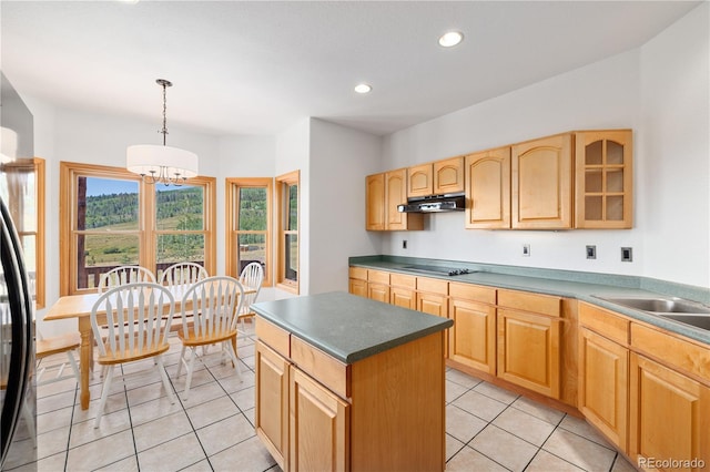 114 Round Hill Rd, Fairplay, CO 80440 - kitchen with under cabinet range hood, black electric stovetop, a chandelier, a center island, and decorative light fixtures