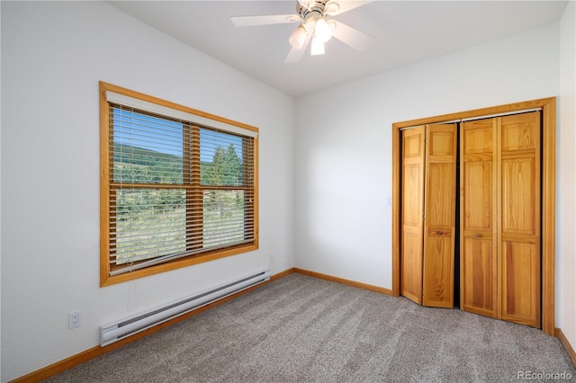 114 Round Hill Rd, Fairplay, CO 80440 - unfurnished bedroom featuring baseboard heating, carpet floors, ceiling fan, and a closet