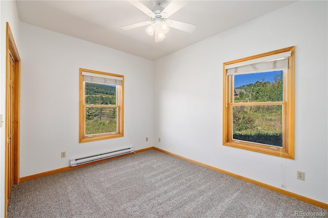 114 Round Hill Rd, Fairplay, CO 80440 - carpeted empty room with a baseboard heating unit, plenty of natural light, and a ceiling fan