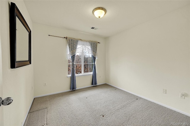 empty room featuring carpet flooring