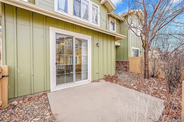 entrance to property featuring a patio