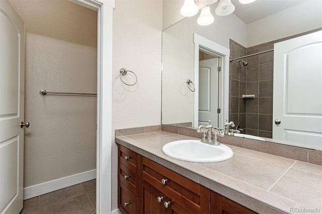 bathroom with tile patterned flooring and vanity