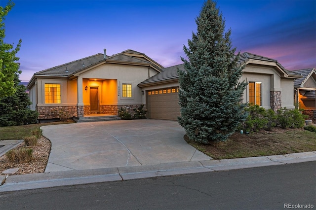 view of front of property with a garage