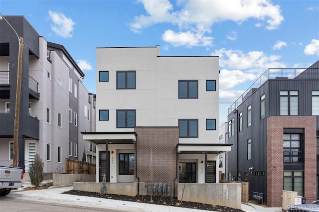 view of building exterior with a fenced front yard