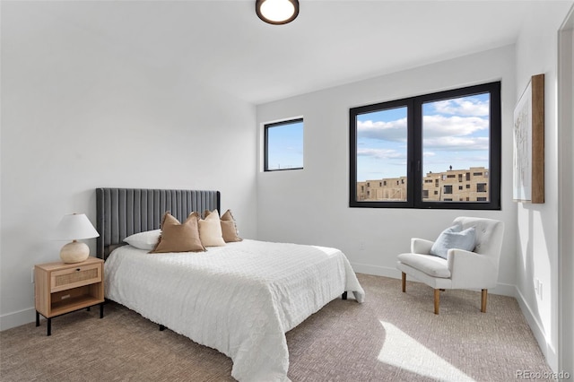 carpeted bedroom with baseboards