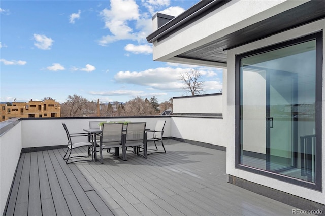 deck with outdoor dining space