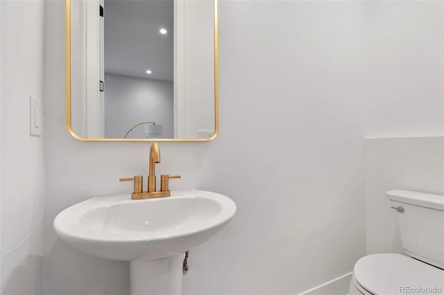 bathroom with a sink and toilet