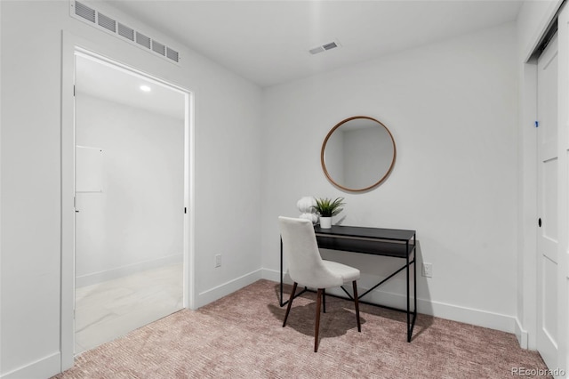 carpeted home office featuring baseboards and visible vents