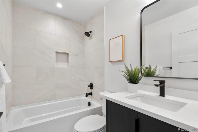 bathroom with toilet, tub / shower combination, and vanity