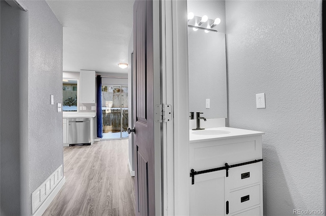 bathroom featuring vanity and hardwood / wood-style flooring