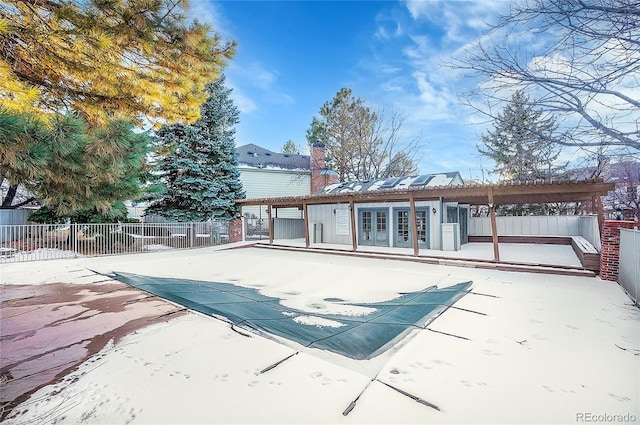 back of house with french doors, a patio, and a covered pool