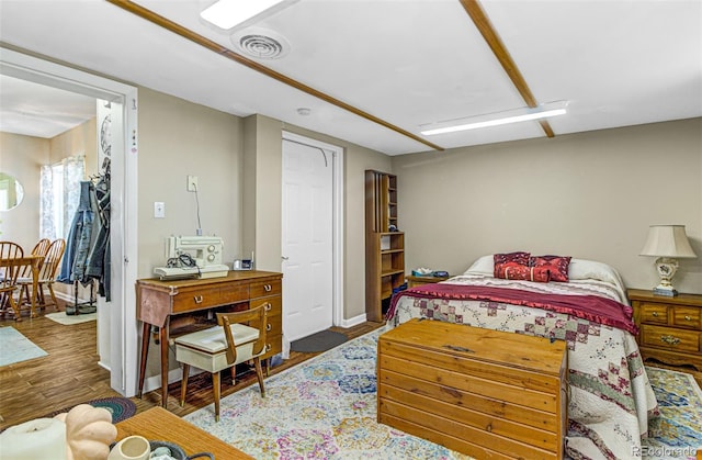 bedroom with wood-type flooring