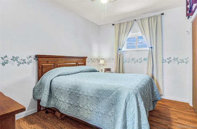 bedroom with hardwood / wood-style flooring