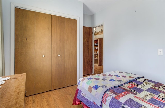 bedroom with a closet and light wood-type flooring