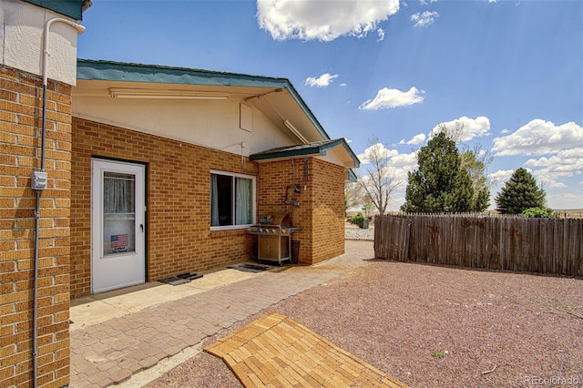 back of property featuring a patio