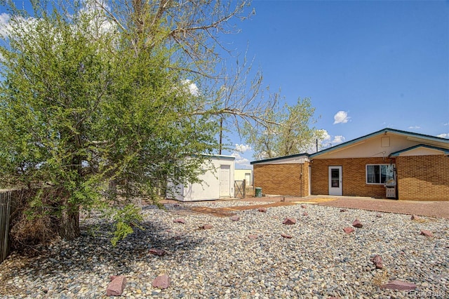 exterior space featuring a storage unit