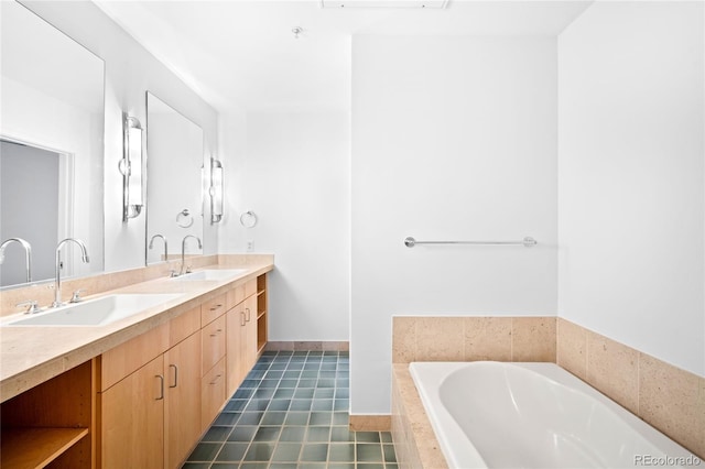 full bathroom with double vanity, a relaxing tiled tub, and tile patterned flooring