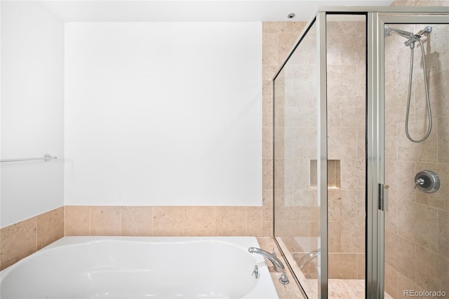 full bath with a garden tub and a shower stall