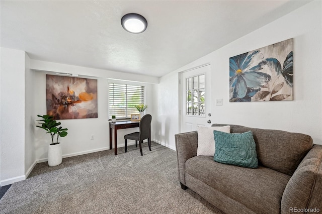 carpeted home office with baseboards