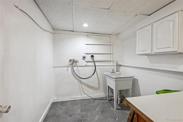 clothes washing area with electric dryer hookup, baseboards, washer hookup, cabinet space, and recessed lighting