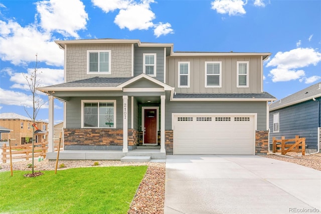 view of front of house featuring a garage and a front lawn