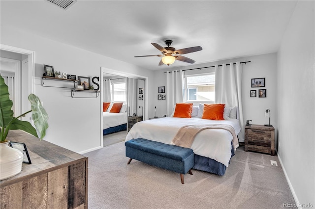 bedroom with baseboards, a ceiling fan, carpet flooring, and visible vents