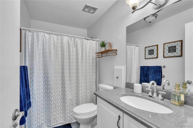 bathroom with visible vents, a shower with curtain, toilet, and vanity
