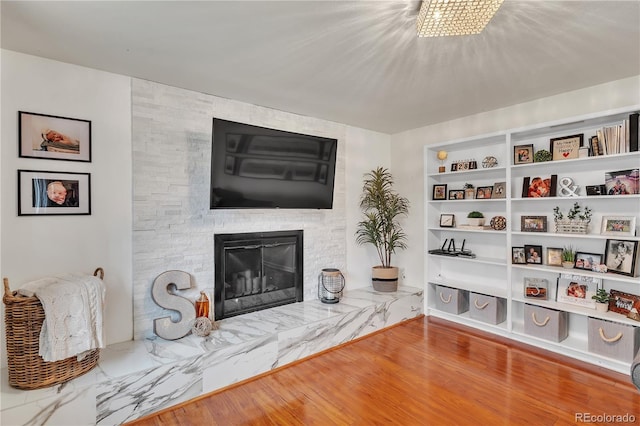 living area featuring a large fireplace