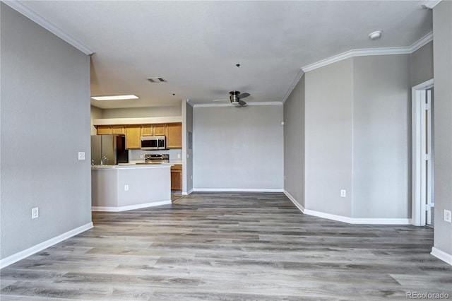 unfurnished living room featuring light hardwood / wood-style floors and ornamental molding