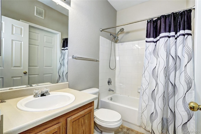 full bathroom with tile patterned flooring, shower / tub combo, vanity, and toilet