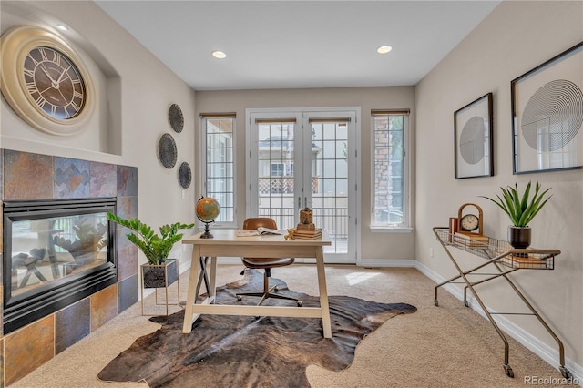 carpeted office featuring baseboards, a fireplace, and recessed lighting