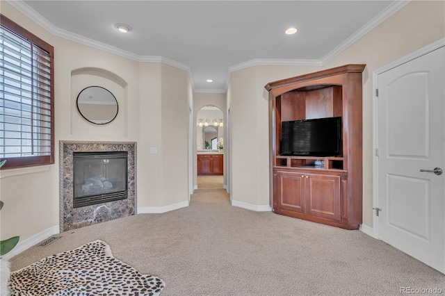 carpeted living room with recessed lighting, ornamental molding, baseboards, and a fireplace