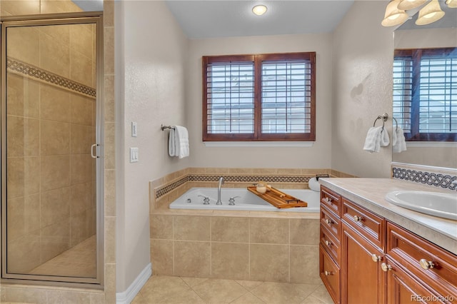 full bathroom featuring tile patterned floors, a garden tub, a stall shower, and a wealth of natural light