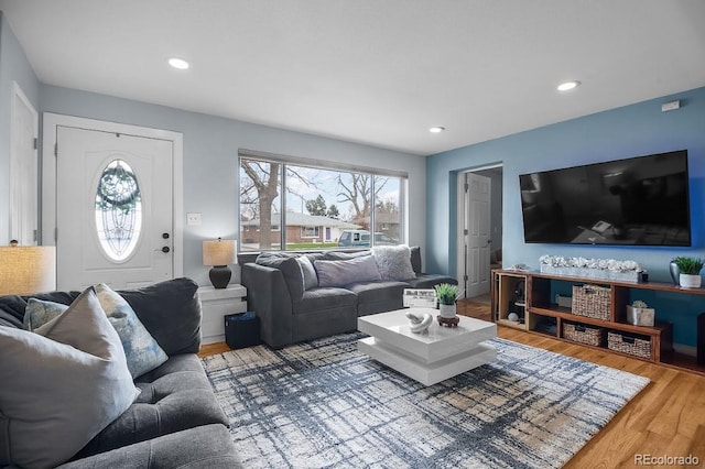 living room with recessed lighting and wood finished floors