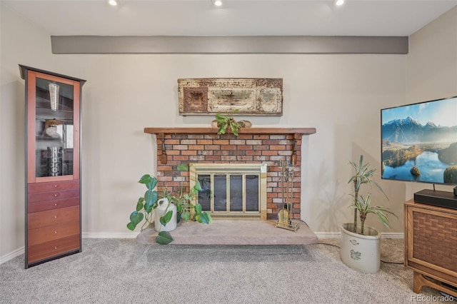 living area with recessed lighting, a brick fireplace, baseboards, and carpet floors