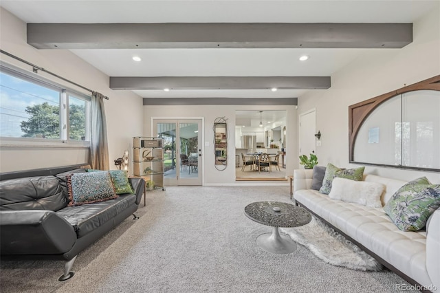 carpeted living area with beam ceiling and recessed lighting